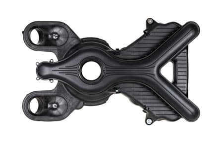 The upper section of a moulded intake manifold, ribbed around a central bore.