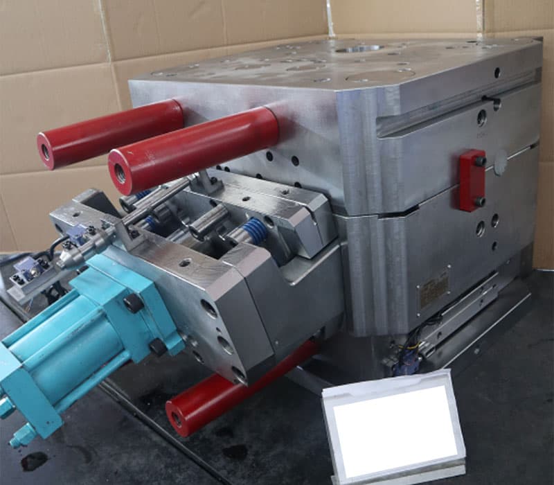 The finished steel mould tool on its stand in the factory, hydraulic core pulls fitted.